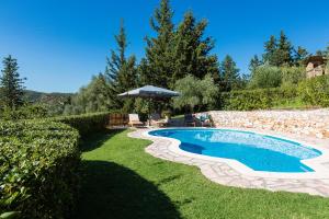 The swimming pool at or close to Vrisali Traditional Stone Villa