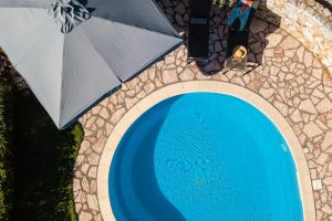 The swimming pool at or close to Vrisali Traditional Stone Villa
