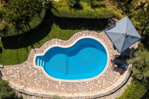 The swimming pool at or close to Vrisali Traditional Stone Villa