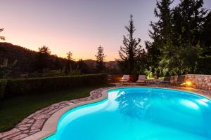 The swimming pool at or close to Vrisali Traditional Stone Villa