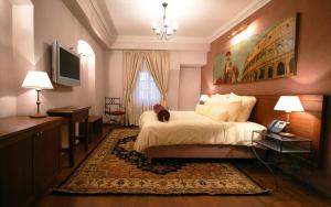 Llit o llits en una habitació de Hotel Mitra, Story Hotels