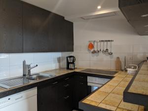 Kuchyň nebo kuchyňský kout v ubytování Casa Sum Naul