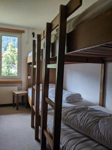 Postel nebo postele na pokoji v ubytování Casa Sum Naul