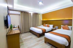 Ένα ή περισσότερα κρεβάτια σε δωμάτιο στο Hotel Lake Star