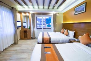 Ένα ή περισσότερα κρεβάτια σε δωμάτιο στο Hotel Lake Star