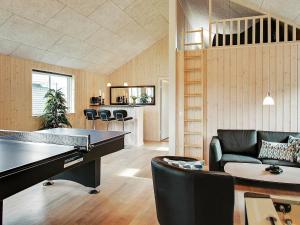 a living room with a ping pong table at 18 person holiday home in Hasselberg in Kappeln