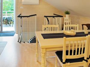 a dining room with a table and chairs at 5 person holiday home in Fj llbacka in Fjällbacka