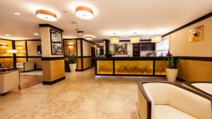 a lobby of a hotel with a waiting room at Hotel Skarbek in Lubin
