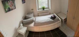 Postel nebo postele na pokoji v ubytování Ferienwohnung „ Zum Josefstal „