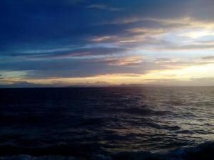 a view of the ocean at sunset at Luxury apartment in the elite area in Athens