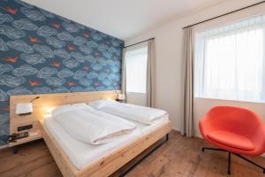 Rúm í herbergi á Berghotel Randolins