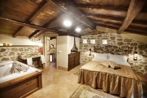 A bed or beds in a room at La Locanda Del Ruspante