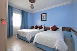 Rúm í herbergi á Hotel Tarek