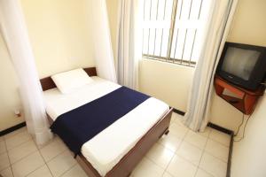 TV a/nebo společenská místnost v ubytování Coastgate Hotel