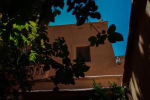 a building with a window on the side of it at Auberge Chez Pierre in Boumalne