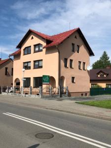 a large building on the side of a street at Apartamenty Ustroń in Ustroń
