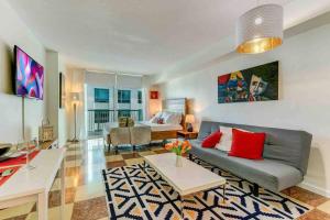 a living room with a couch and a table at Beautiful Apartments in Miami Brickell in Miami