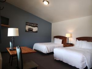 Säng eller sängar i ett rum på Big Bear Motel