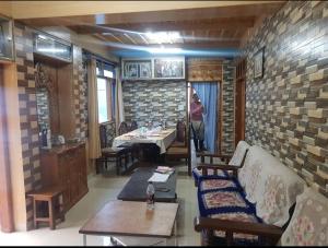 a room with a couch and a table in a room at The Heritage, Sarahan in Sarāhan