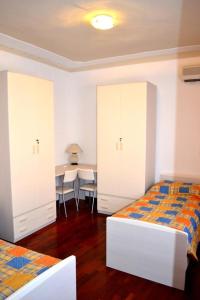 Postel nebo postele na pokoji v ubytování B&B Reginetta