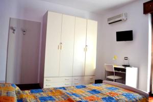 Postel nebo postele na pokoji v ubytování B&B Reginetta