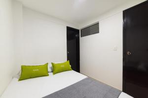 Ένα ή περισσότερα κρεβάτια σε δωμάτιο στο Ayenda 1122 Victoria