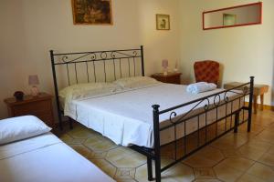 A bed or beds in a room at La casa di mare Salento