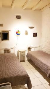 Posteľ alebo postele v izbe v ubytovaní Paros Sunset Villa + 37 fotografií