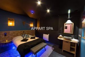 a hotel room with a bed and a sink in it at Autrement Spa in Avelin