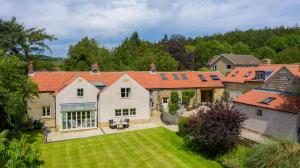 an aerial view of a house with a yard at Drake Cottage in Whitby