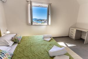 En eller flere senger på et rom på Villa Decima