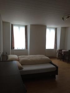 Postel nebo postele na pokoji v ubytování Hotel Alpina