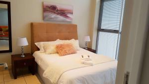 Postel nebo postele na pokoji v ubytování Nautica 708 Seaview Luxury Apartment + 16 fotografií