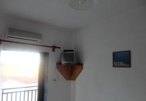 TV a/nebo společenská místnost v ubytování Chris Apartments
