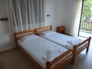 Postel nebo postele na pokoji v ubytování Chris Apartments