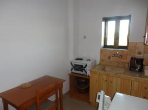 Kuchyň nebo kuchyňský kout v ubytování Chris Apartments