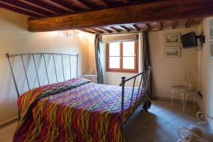Postel nebo postele na pokoji v ubytování Agriturismo Il Poderaccio