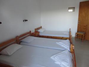 Postel nebo postele na pokoji v ubytování Chris Apartments