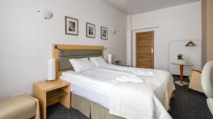 Posteľ alebo postele v izbe v ubytovaní 404 Rooms Wilanowska