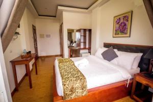 Postel nebo postele na pokoji v ubytování El Nido Royal Palm Inn