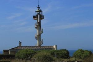 a tower with a cross on top of a building at Côte et Mer in Le Portel