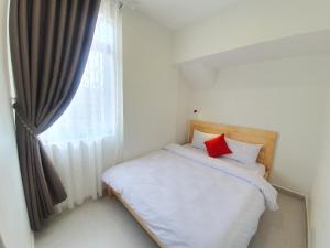 Postel nebo postele na pokoji v ubytování Hello Dalat Hostel