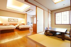 Cama ou camas em um quarto em Hotel Taisetsu Onsen&Canyon Resort