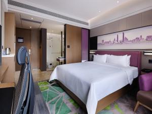 Ένα ή περισσότερα κρεβάτια σε δωμάτιο στο Hampton by Hilton Guangzhou Dongxiaonan
