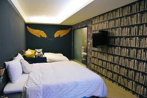 Кровать или кровати в номере Tian Fang Ye Tan Hotel