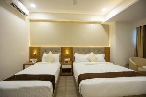 Postel nebo postele na pokoji v ubytování Hotel Grace Galaxy