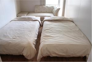 Letto o letti in una camera di コトのアート研究所