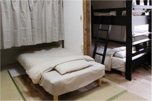 Letto o letti in una camera di コトのアート研究所
