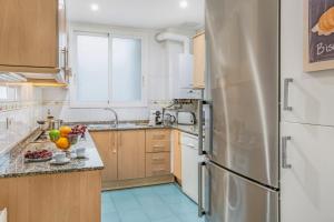 Kuchyňa alebo kuchynka v ubytovaní Stay U-nique Apartments Ricart