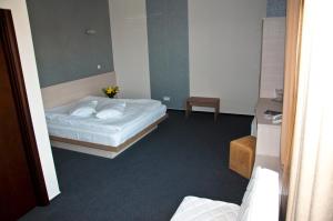 Postel nebo postele na pokoji v ubytování Albert Hotel